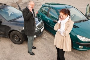 Car accident. people talking on phones next to crashed cars